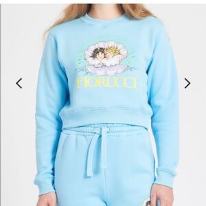 FIORUCCI | Venus Angel Crop Sweatshirt in Pale Blue. Never worn. No tags.